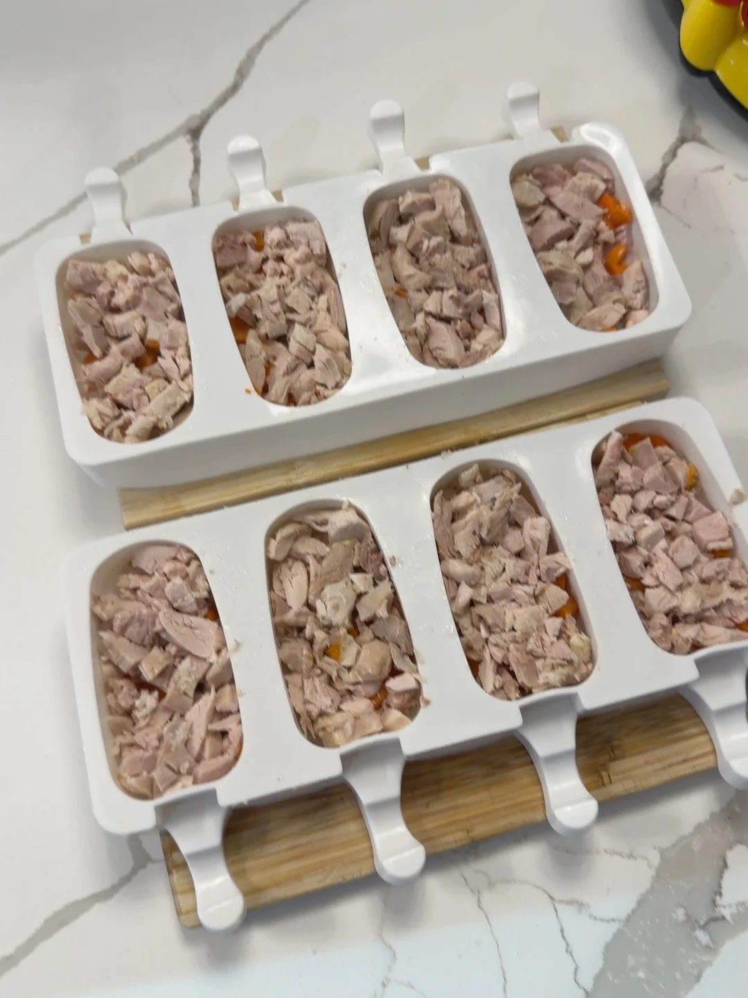 Cooked meat arranged in individual molds.
